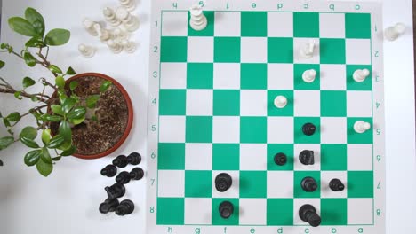 Chessman Moving Chess Pieces Horizontally On The Board. top view
