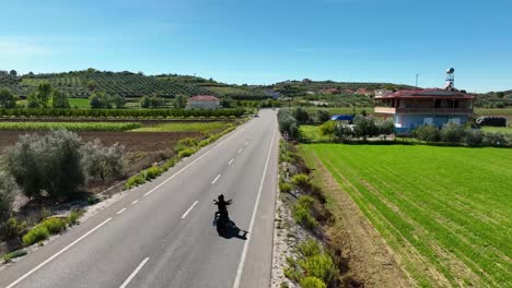 motorcycle chopper riding on countryside near farmland