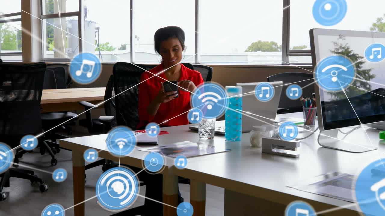 Animation of network of connections with icons over biracial businesswoman in office