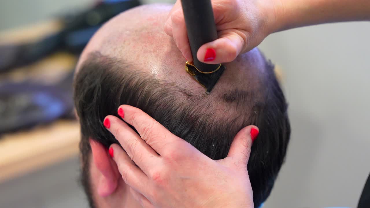 Haircut of a bald head