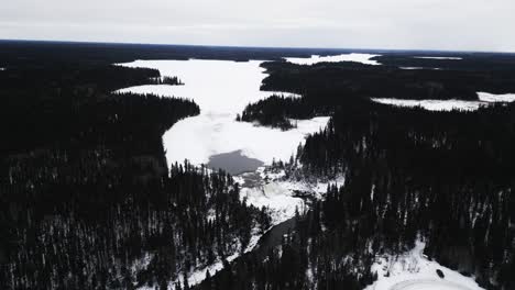 high air aerial 4k drone shot environment nature tourism travel landmark frozen winter water pisew kwasitchewan falls waterfall provincial park thompson manitoba northern arctic canada landscape