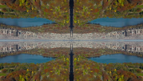 Sunny-autumn-day.-Aerial-footage-of-colourful-foliage-on-trees-at-water-and-urban-borough-in-background.-Abstract-computer-effect-digital-composed-footage