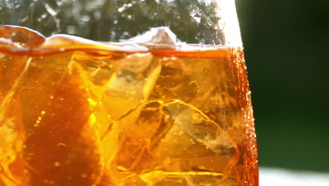 Refreshing-orange-drink-in-the-sun---180fps