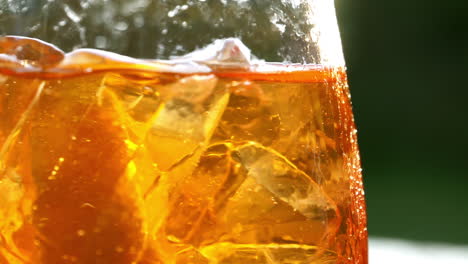 refreshing orange drink in the sun - 180fps