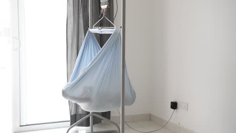 baby sleeping in electronic cradle swing