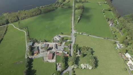 Green-Fields-Surrounding-Blessington-Lake-In-County-Wicklow,-Ireland---drone-shot