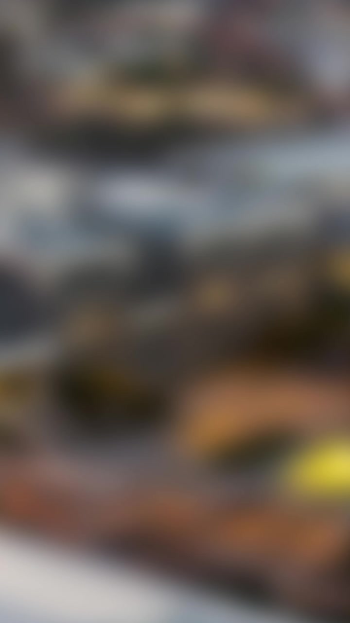 Animation of golden key and house over cityscape