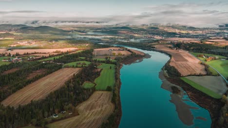 aerial view of the rural landscape on the shores of the namsen river, trondelag, norway