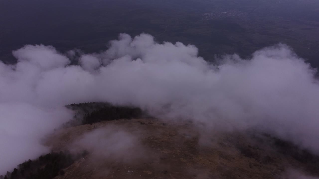 Clouds over mountain taken by drone