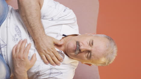 vertical video of old man with shortness of breath.