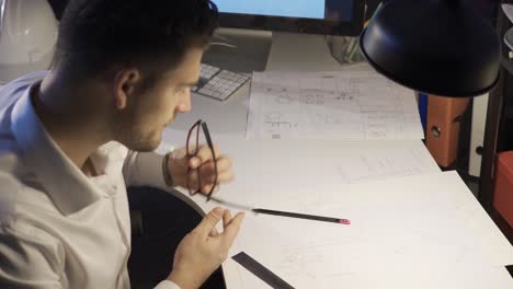 male designer working in modern office for a new project. interior architecture.