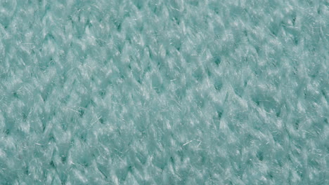 close-up view of a teal knitted fabric