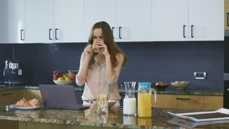 business woman having a videocall in luxury kitchen