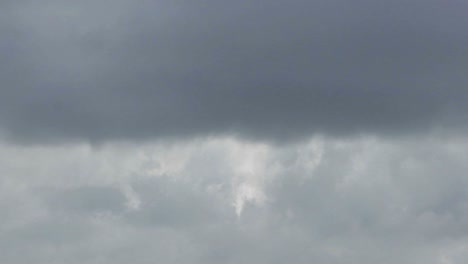 time lapse of white and grey clouds moving quickly