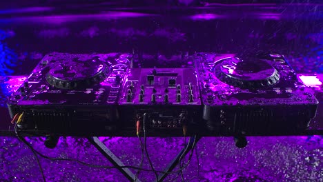 dj equipment in a rainy night scene