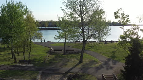 A-low-altitude-drone-view-of-a-quiet-park-on-a-sunny-morning