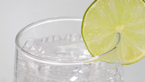 lime soda water in a glass with ice