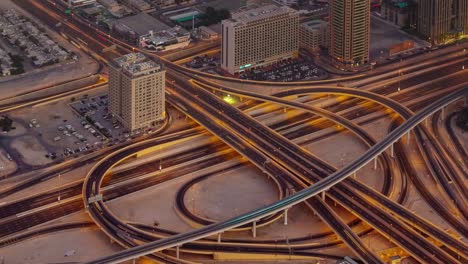 sunset night illumination traffic road junction roof top view 4k time lapse united arab emirates