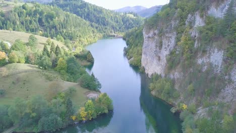 Cinematic-4k-shot-of-small-lake-and-rocks-in-green-forest