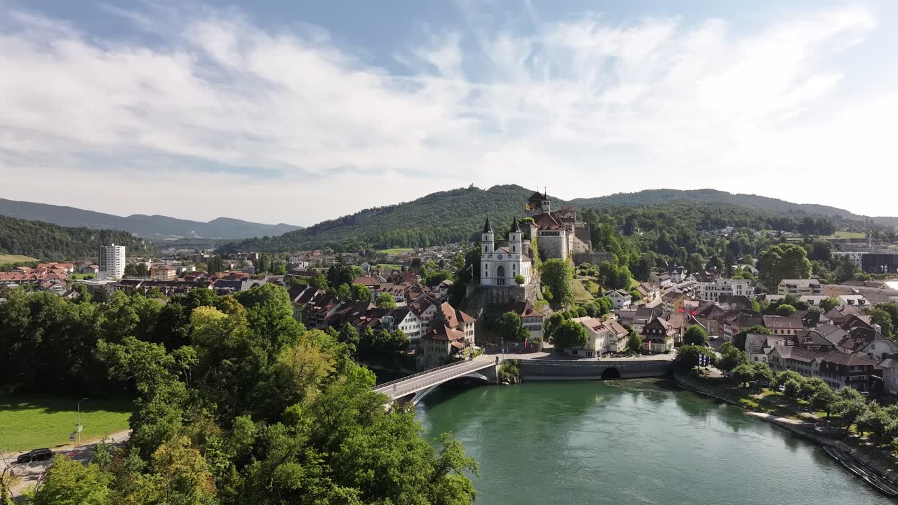 Drone view of Aarburg castle and church above the Aare River with scenic Swiss town