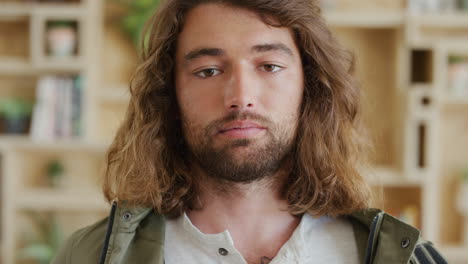 portrait of a man with long curly hair