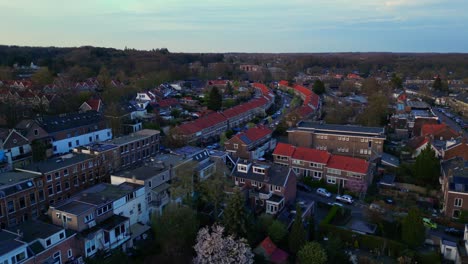 Drone-forward-over-traditional-Dutch-living-neighborhood-in-Arnhem-town-Gelderland