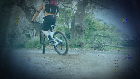 male cyclist riding bike on forest trail, kicking up dust with animated fitness stats overlay