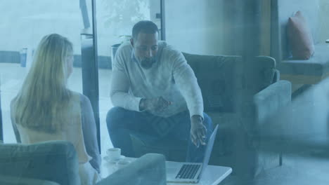 animation of data processing over diverse business people working at office