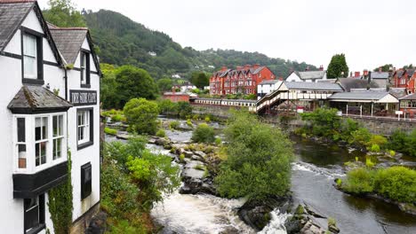 picturesque town with river and historic buildings