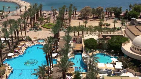 beautiful hotel with pools and beach view