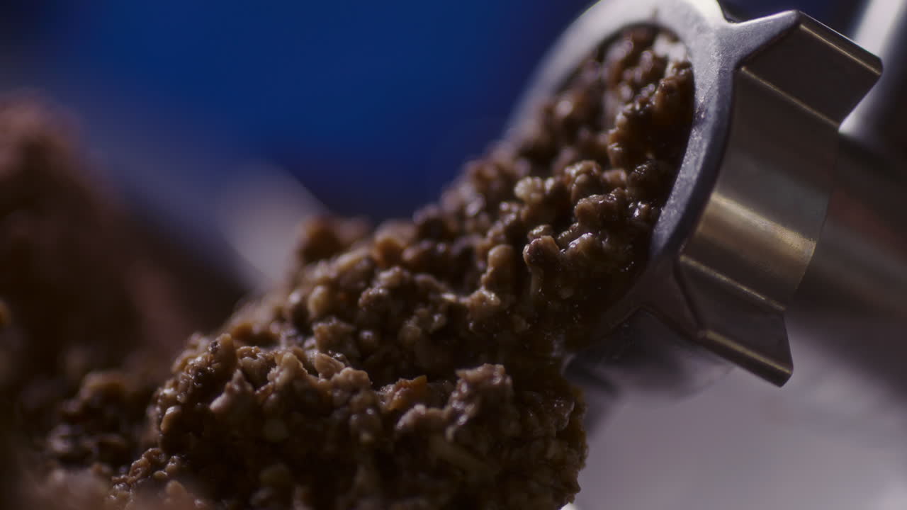 Grinding mushrooms in a grinder