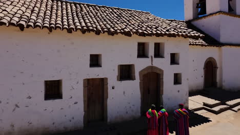 ancient andean village with terraced fields and a central church
