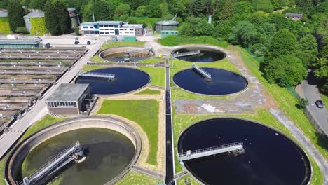 aerial top view of circular ponds in wastewater treatment plant and filtration of dirty sewage water