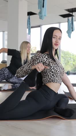 women gracefully showcase flexibility and strength in a sunny yoga studio women gracefully showcase flexibility and strength in a sunny yoga studio