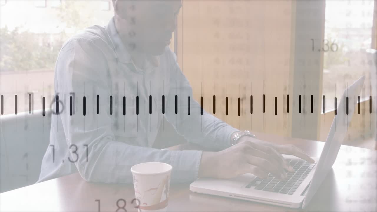 Man typing on laptop by window and overlaying finance graph with numeric labels, tracking markets