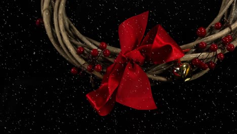 Animation-of-christmas-decoration-with-red-ribbon-and-snow-falling