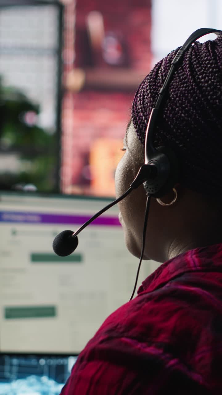 Vertical video Call center worker in office using AI chatbot to reply to customers