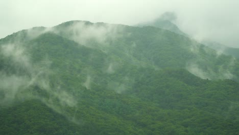 Cirrus-Clouds-Over-The-Lush-Mountains-In-South-Korea---Beautiful-Scenery-smoke-over-mountains