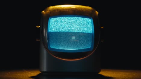 retro tv, vintage television in a nostalgic setup, a retro tv displays grain on screen, scary halloween night device good for chroma key and green screen. high quality 4k footage
