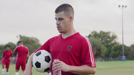 soccer player drinking water