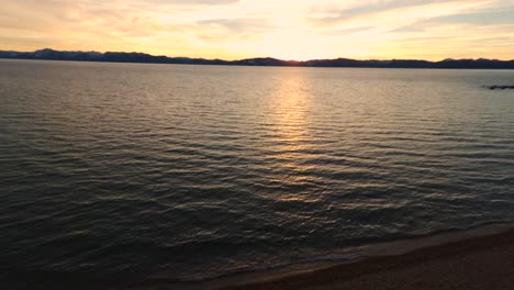 A-peaceful-evening-along-with-orange-sun-at-the-beach-from-the-air