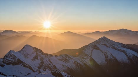 sunrise over snow-capped mountains