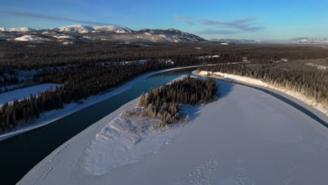 aerial shot of frozen lake laberge in yukon, canada
