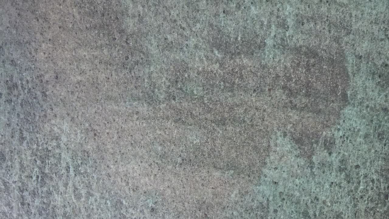 Aerial Top Down View of Clear Ocean Water and Coral Reef
