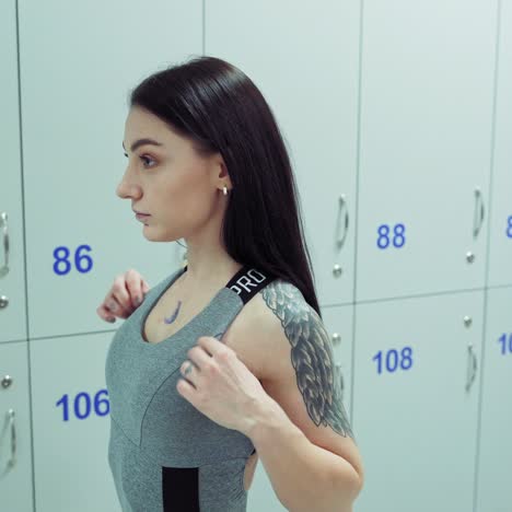 woman looking at reflection in dressing room