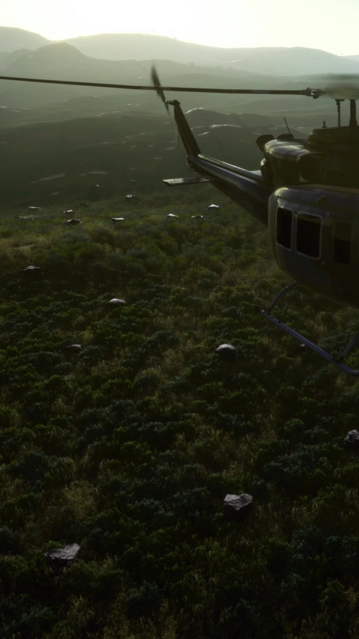 Helicopter flying over green landscape with white objects scattered below
