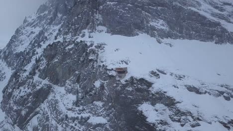 remote mountain cabin in the snow