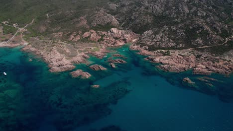 panoramic aerial view from top of rocky coastline of sardinia in italy, volcanic landscape, protected area