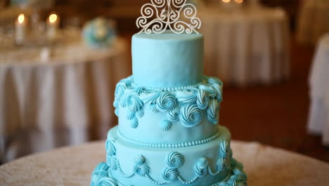 a beautiful blue three-tier wedding cake