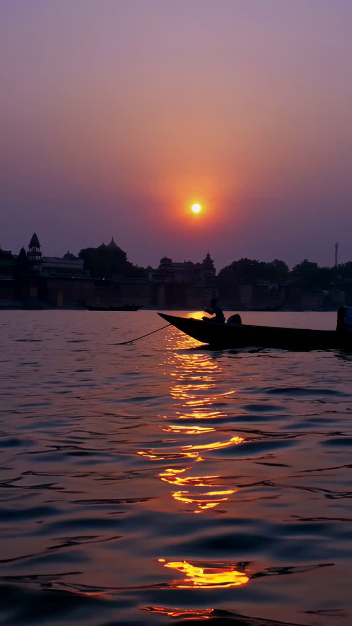 Vibrant Sunset over a River Cityscape with a Boat